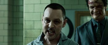 Movie still from “Punisher: War Zone” (2008), directed by Lexi Alexander – A person with a beard and mustache; Close Up shot, Over the shoulder angle