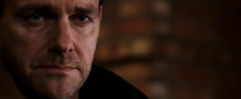 Movie still from “Punisher: War Zone” (2008), directed by Lexi Alexander – A man's face in front of a brick wall; Close Up shot, Low angle