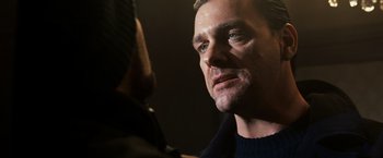 Movie still from “Punisher: War Zone” (2008), directed by Lexi Alexander – A man's face as he looks into the camera; Close Up shot, Over the shoulder angle