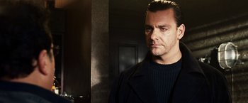 Movie still from “Punisher: War Zone” (2008), directed by Lexi Alexander – A person standing in a room; Close Up shot, Low angle