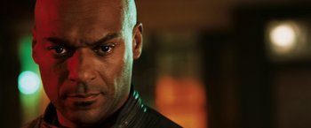 Movie still from “Punisher: War Zone” (2008), directed by Lexi Alexander – A man's face in a leather jacket; Close Up shot, Low angle