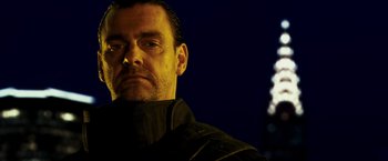Movie still from “Punisher: War Zone” (2008), directed by Lexi Alexander – A person wearing a black jacket; Close Up shot, Low angle