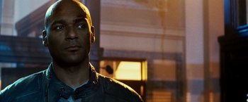 Movie still from “Punisher: War Zone” (2008), directed by Lexi Alexander – A person wearing a jacket; Close Up shot, Over the shoulder angle