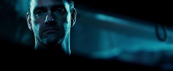 Movie still from “Punisher: War Zone” (2008), directed by Lexi Alexander – A man's face in the dark; Close Up shot, Low angle