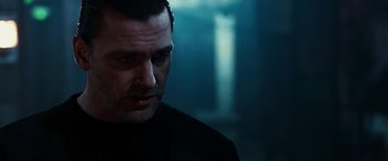 Movie still from “Punisher: War Zone” (2008), directed by Lexi Alexander – A person wearing a black shirt; Close Up shot, Low angle