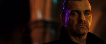 Movie still from “Punisher: War Zone” (2008), directed by Lexi Alexander – A person wearing a black jacket; Close Up shot, Low angle