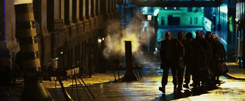 Movie still from “Punisher: War Zone” (2008), directed by Lexi Alexander – A man walking down a street at night; Wide shot, Low angle