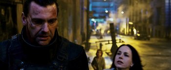 Movie still from “Punisher: War Zone” (2008), directed by Lexi Alexander – A man and a woman in the street at night; Close Up shot, Over the shoulder angle