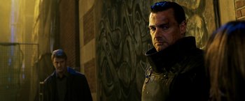 Movie still from “Punisher: War Zone” (2008), directed by Lexi Alexander – A person wearing a leather jacket; Close Up shot, Over the shoulder angle