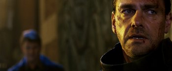 Movie still from “Punisher: War Zone” (2008), directed by Lexi Alexander – A person wearing a black shirt; Close Up shot, Low angle