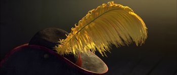 Movie still from “Puss in Boots” (2011), directed by Chris Miller – A yellow feather on top of a black hat; Extreme Close Up shot, High angle