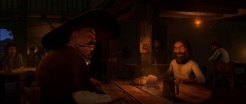 Movie still from “Puss in Boots” (2011), directed by Chris Miller – A man sitting at a table in a dark room; Medium shot, Over the shoulder angle