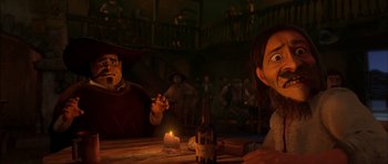 Movie still from “Puss in Boots” (2011), directed by Chris Miller – A man sitting at a table in front of a bottle of wine; Medium shot, Over the shoulder angle