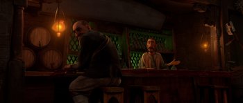 Movie still from “Puss in Boots” (2011), directed by Chris Miller – A man sitting at a table in front of another man; Medium shot, Over the shoulder angle