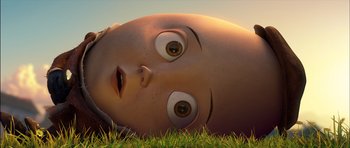 Movie still from “Puss in Boots” (2011), directed by Chris Miller – An image of an animated character laying in the grass; Close Up shot, Low angle