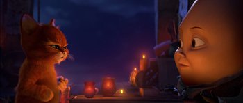 Movie still from “Puss in Boots” (2011), directed by Chris Miller – Candles lit on a table in front of a window; Wide shot, Over the shoulder angle