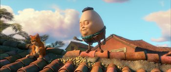 Movie still from “Puss in Boots” (2011), directed by Chris Miller – An animated egg character standing on a roof; Medium shot, Low angle
