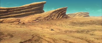 Movie still from “Puss in Boots” (2011), directed by Chris Miller – An image of an animal in the middle of the desert; Extreme Wide shot, High angle