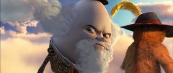 Movie still from “Puss in Boots” (2011), directed by Chris Miller – An image of an animated character with a beard; Close Up shot, Low angle