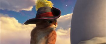 Movie still from “Puss in Boots” (2011), directed by Chris Miller – An orange and white cat wearing a black hat; Close Up shot, Low angle