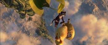 Movie still from “Puss in Boots” (2011), directed by Chris Miller – A cat and a duck are flying through the sky; Wide shot, Low angle