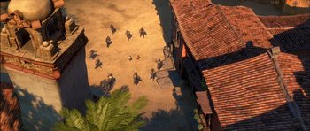 Movie still from “Puss in Boots” (2011), directed by Chris Miller – A group of people standing on top of a dirt road; Extreme Wide shot, High angle