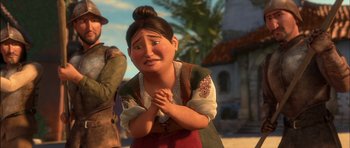 Movie still from “Puss in Boots” (2011), directed by Chris Miller – An animated woman with her hands clasped in front of her face; Medium shot, Over the shoulder angle