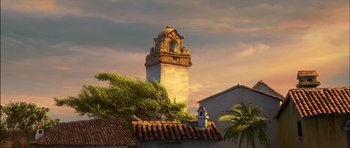 Movie still from “Puss in Boots” (2011), directed by Chris Miller – An image of a building with a clock tower in the background; Extreme Wide shot, Low angle