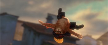 Movie still from “Puss in Boots” (2011), directed by Chris Miller – An orange and white cat flying through the air with a skateboard; Close Up shot, Low angle
