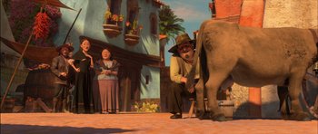 Movie still from “Puss in Boots” (2011), directed by Chris Miller – An animated scene of a man and a woman petting an elephant; Wide shot, Low angle