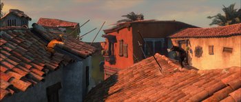 Movie still from “Puss in Boots” (2011), directed by Chris Miller – An orange building with a bunch of windows on top of it; Extreme Wide shot, Low angle