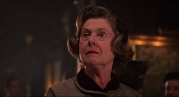 Movie still from “Quiz Show” (1994), directed by Robert Redford – An older woman with a serious look on her face; Close Up shot, Low angle