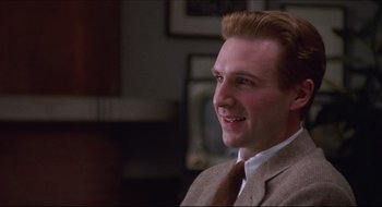 Movie still from “Quiz Show” (1994), directed by Robert Redford – A person wearing a suit and tie; Close Up shot, Low angle