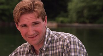 Movie still from “Quiz Show” (1994), directed by Robert Redford – A person wearing a plaid shirt near a body of water; Close Up shot, Low angle
