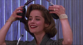 Movie still from “Quiz Show” (1994), directed by Robert Redford – A woman is getting her hair done in a salon; Close Up shot, Low angle
