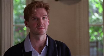 Movie still from “Quiz Show” (1994), directed by Robert Redford – A person wearing a jacket; Close Up shot, Over the shoulder angle