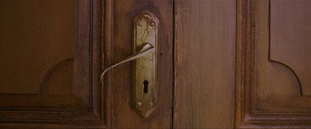 Movie still from “Raazi” (2018), directed by Meghna Gulzar – A door handle on a wooden door; Extreme Close Up shot, High angle