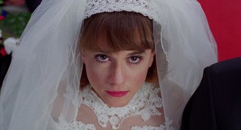 Movie still from “Raising Arizona” (1987), directed by Joel Coen – A person wearing a wedding veil; Close Up shot, Overhead angle