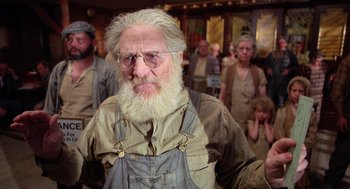 Movie still from “Raising Arizona” (1987), directed by Joel Coen – An old man with a long white beard; Close Up shot, Low angle