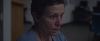 Movie still from “Nomadland” (2020), directed by Chloé Zhao – A person looking at the camera; Close Up shot, Over the shoulder angle