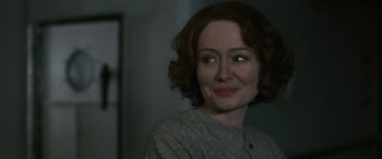 Movie still from “Reaching for the Moon” (2013), directed by Bruno Barreto – A person with short hair; Close Up shot, Over the shoulder angle