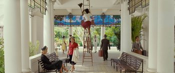 Movie still from “Reaching for the Moon” (2013), directed by Bruno Barreto – A woman standing on top of a wooden ladder; Wide shot, Low angle