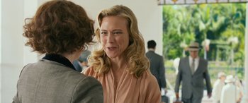 Movie still from “Reaching for the Moon” (2013), directed by Bruno Barreto – A woman with blonde hair talking to another woman; Close Up shot, Over the shoulder angle