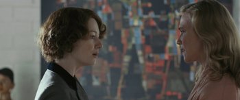 Movie still from “Reaching for the Moon” (2013), directed by Bruno Barreto – A woman standing in front of a painting; Close Up shot, Over the shoulder angle