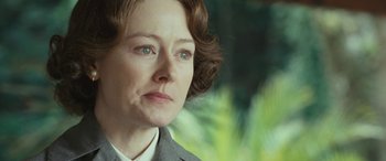 Movie still from “Reaching for the Moon” (2013), directed by Bruno Barreto – A person wearing a suit and tie; Close Up shot, Low angle