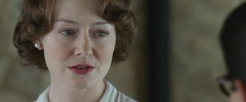 Movie still from “Reaching for the Moon” (2013), directed by Bruno Barreto – A woman's face in a white shirt; Close Up shot, Over the shoulder angle