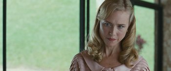 Movie still from “Reaching for the Moon” (2013), directed by Bruno Barreto – A person with blonde hair; Close Up shot, Over the shoulder angle