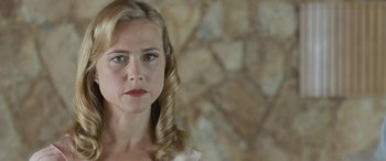 Movie still from “Reaching for the Moon” (2013), directed by Bruno Barreto – A person wearing a white shirt; Close Up shot, Low angle