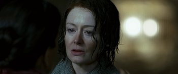 Movie still from “Reaching for the Moon” (2013), directed by Bruno Barreto – A person with wet hair; Close Up shot, Over the shoulder angle