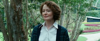 Movie still from “Reaching for the Moon” (2013), directed by Bruno Barreto – A person with short hair wearing a white shirt; Close Up shot, Low angle